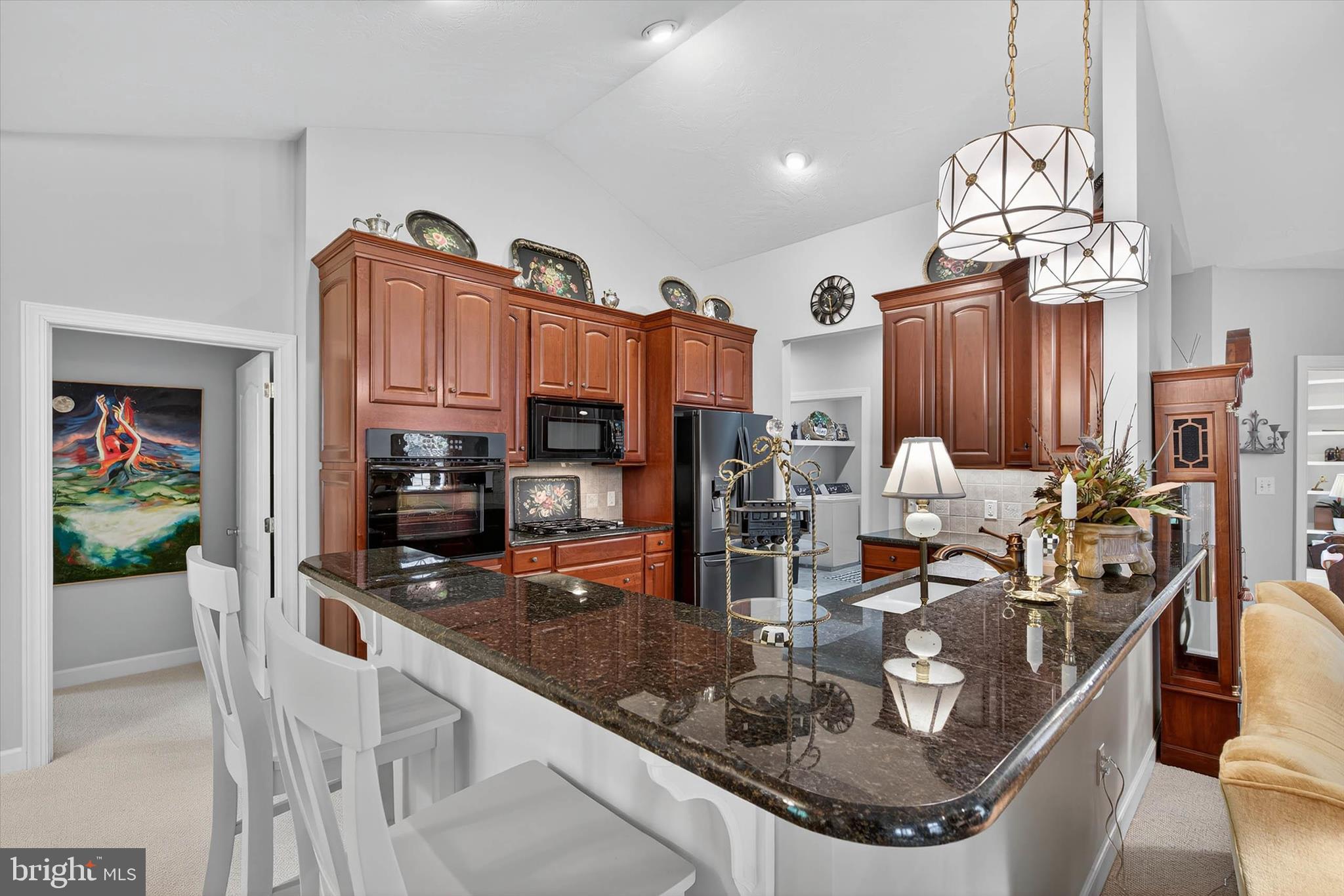 1029 Stonecroft Drive Hanover, PA 17331 - Photo 18 of 72 a kitchen with stainless steel appliances granite countertop a sink a stove and a wooden cabinets