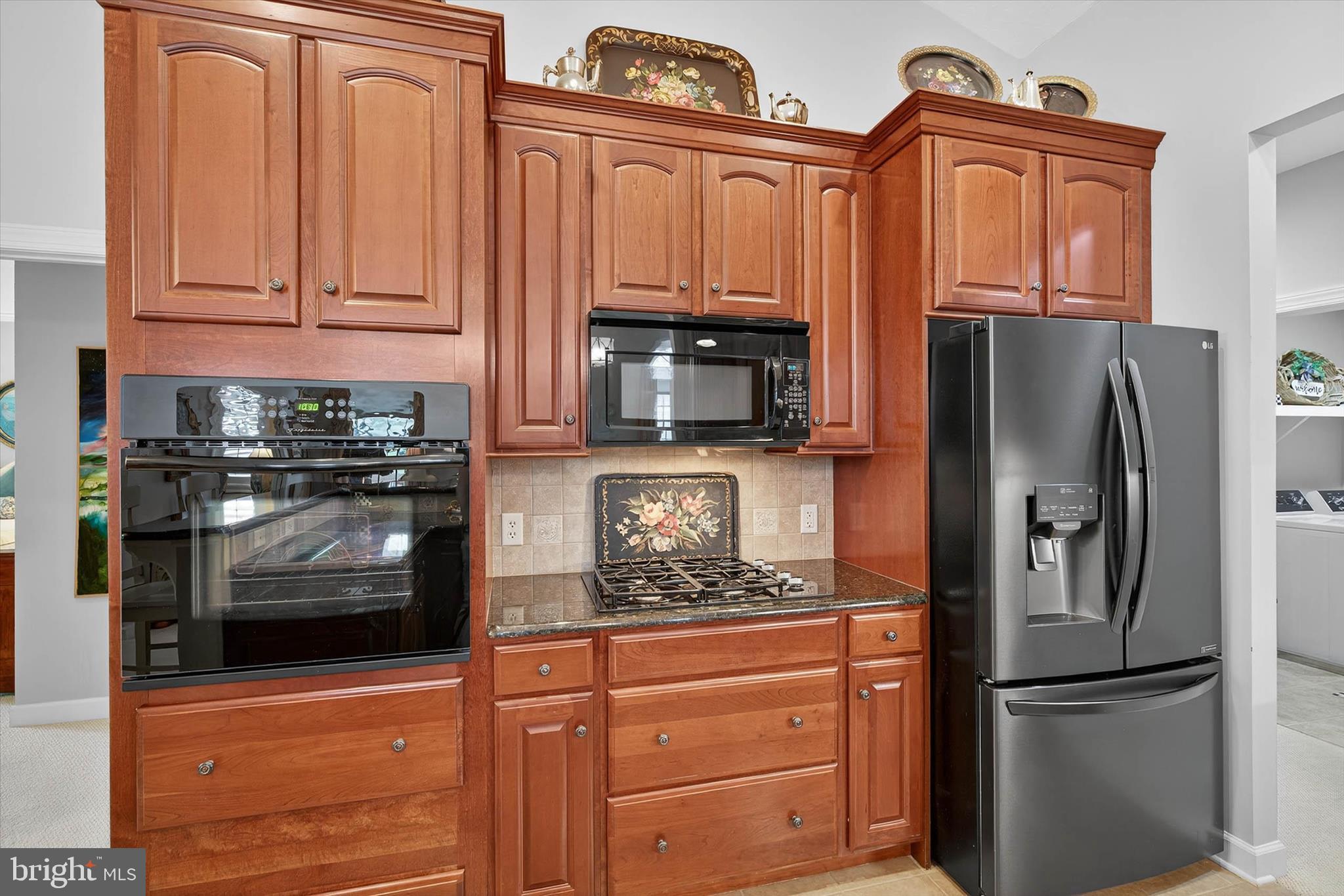 1029 Stonecroft Drive Hanover, PA 17331 - Photo 22 of 72 a kitchen with stainless steel appliances granite countertop a refrigerator stove and cabinets