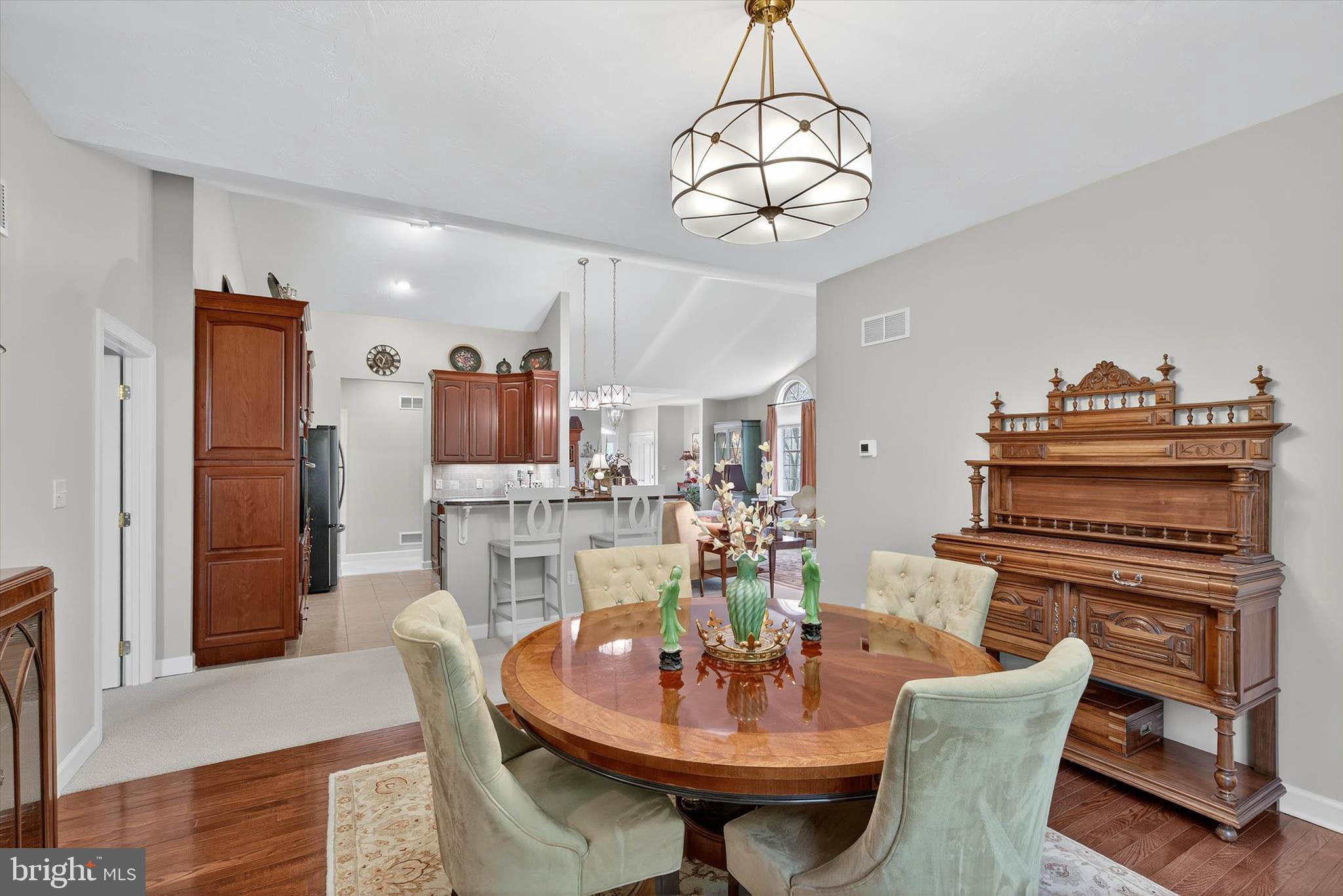 1029 Stonecroft Drive Hanover, PA 17331 - Photo 26 of 72 a view of a dining room with furniture a chandelier and wooden floor