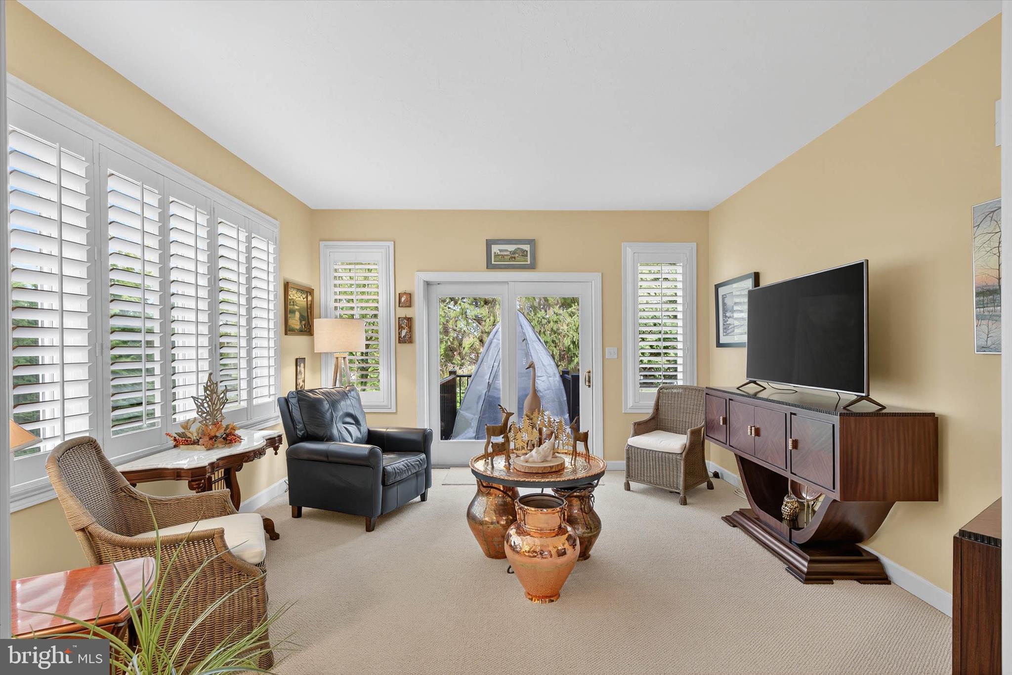 1029 Stonecroft Drive Hanover, PA 17331 - Photo 27 of 72 a living room with furniture a flat screen tv and a large window
