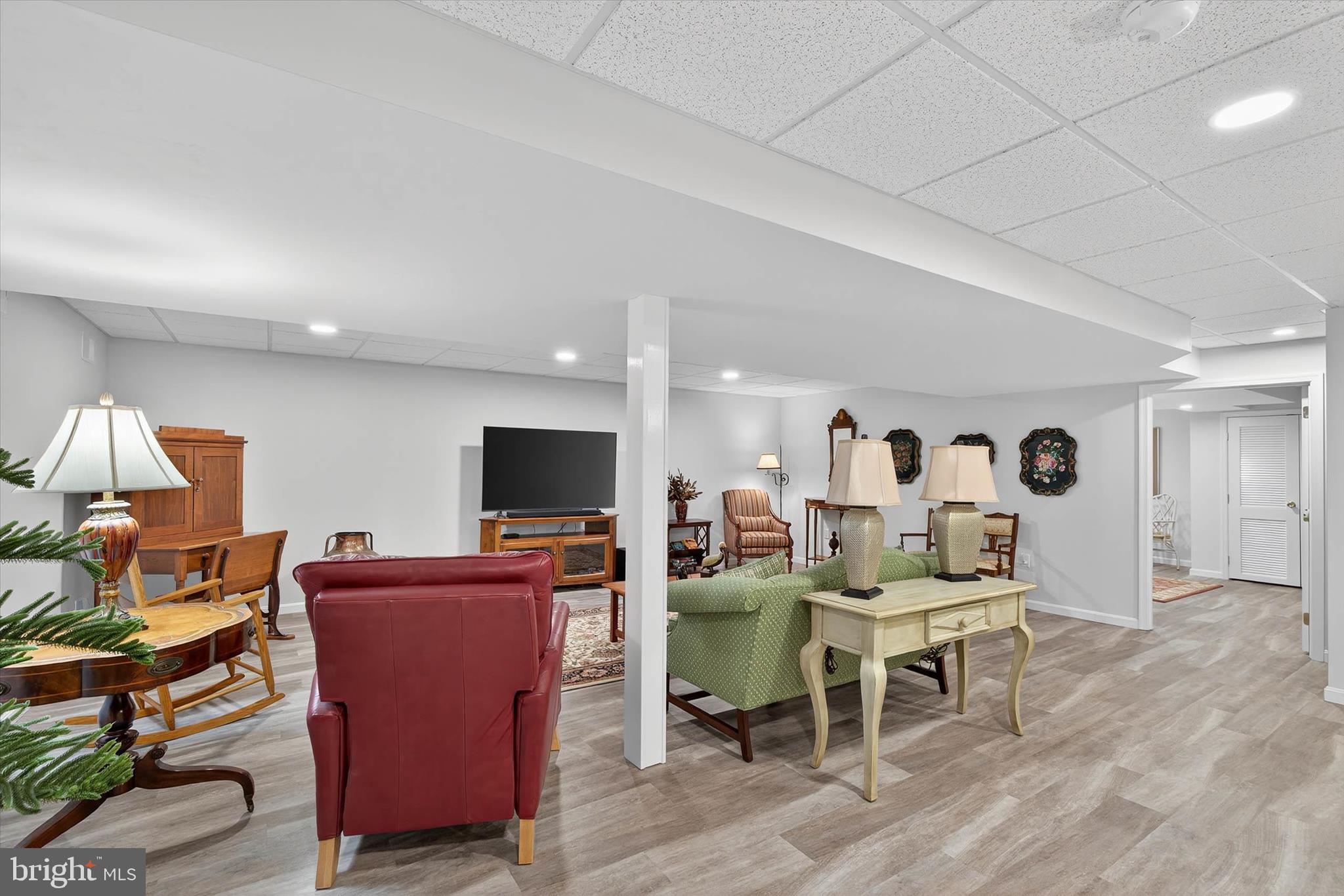 1029 Stonecroft Drive Hanover, PA 17331 - Photo 47 of 72 a living room with furniture a flat screen tv and kitchen view