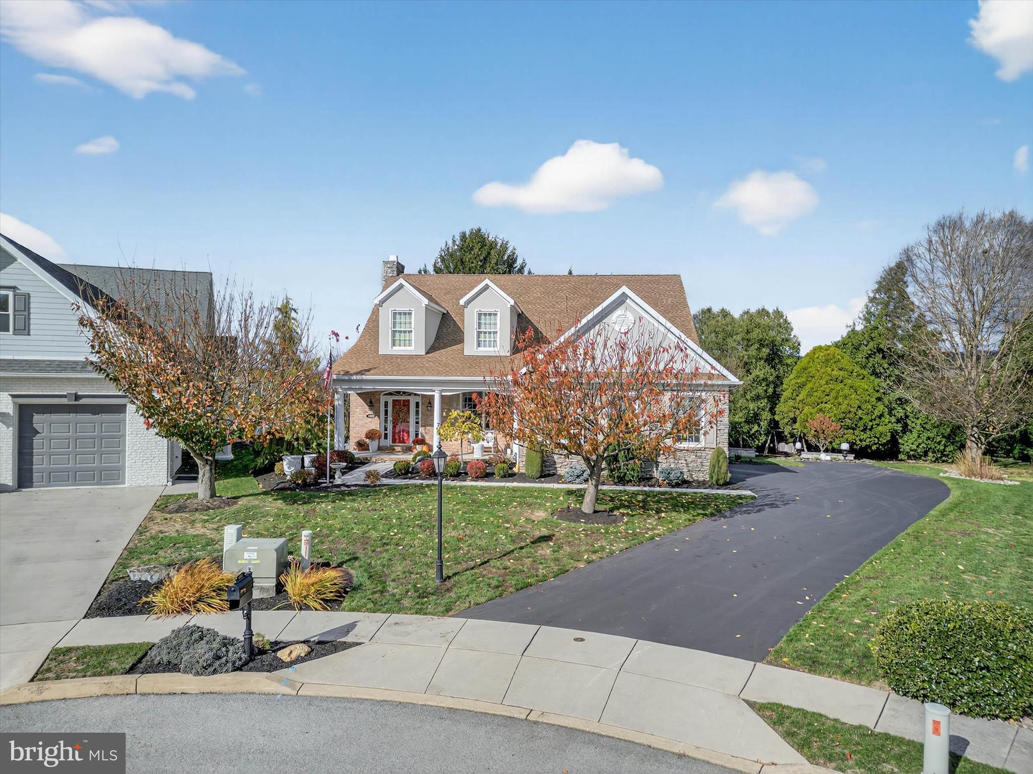 1029 Stonecroft Drive Hanover, PA 17331 - Photo 8 of 72 a view of a white house with a big yard and potted plants