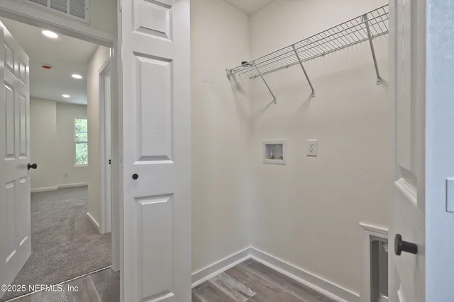 a bathroom with a granite countertop toilet sink and mirror