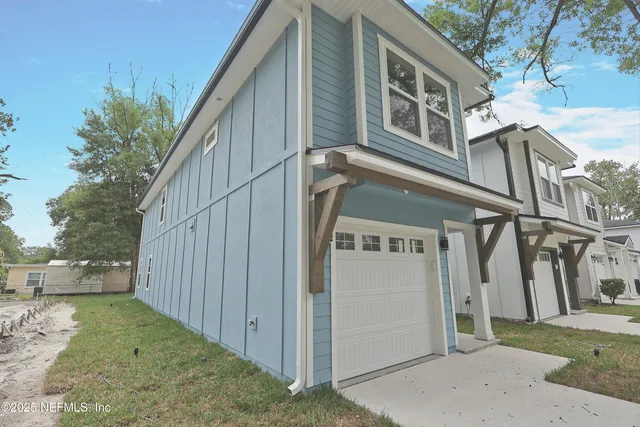 a view of a street with a house