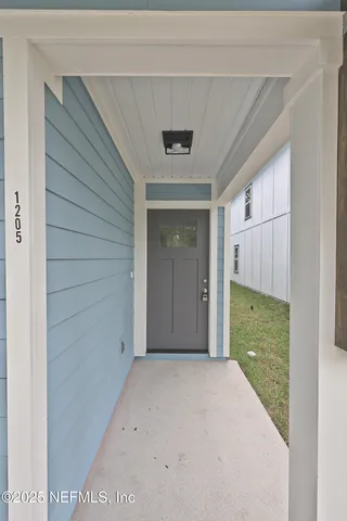 a view of hallway with windows