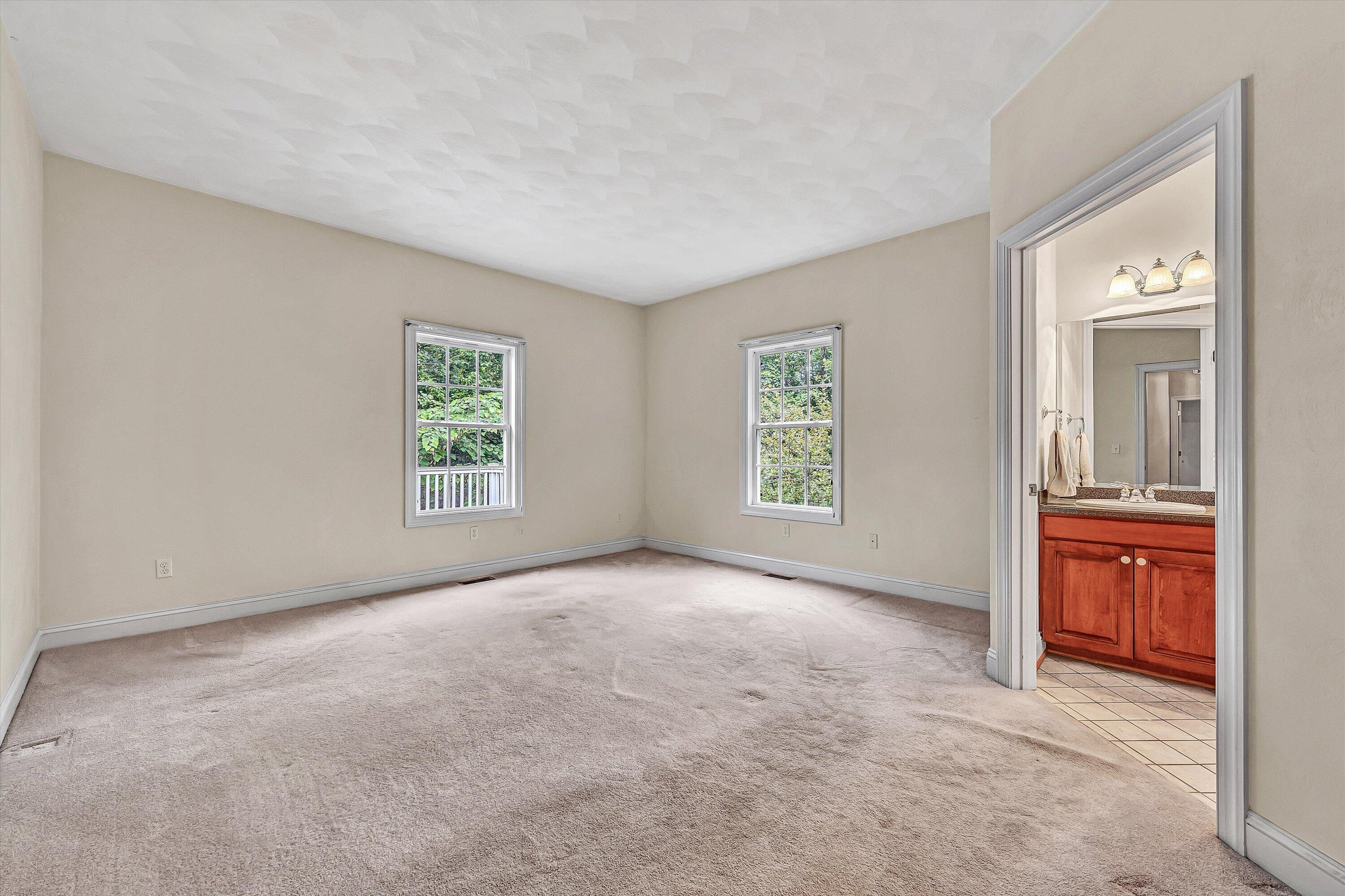 131 Stoney Mill Road Rocky Mount, VA 24151 - Photo 19 of 37 an empty room with windows and mirror