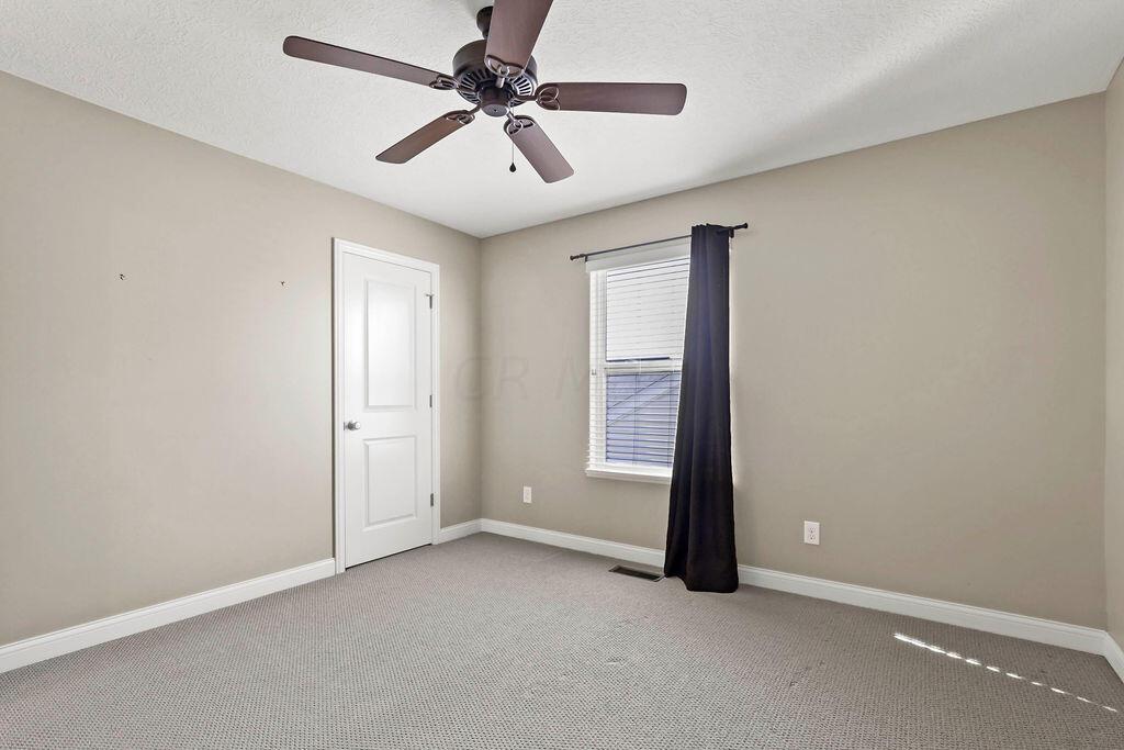 6163 Jennis Road Westerville, OH 43081 - Photo 32 of 44 • Tan carpet
• Tan painted walls
• Ceiling fan
• 2” blinds