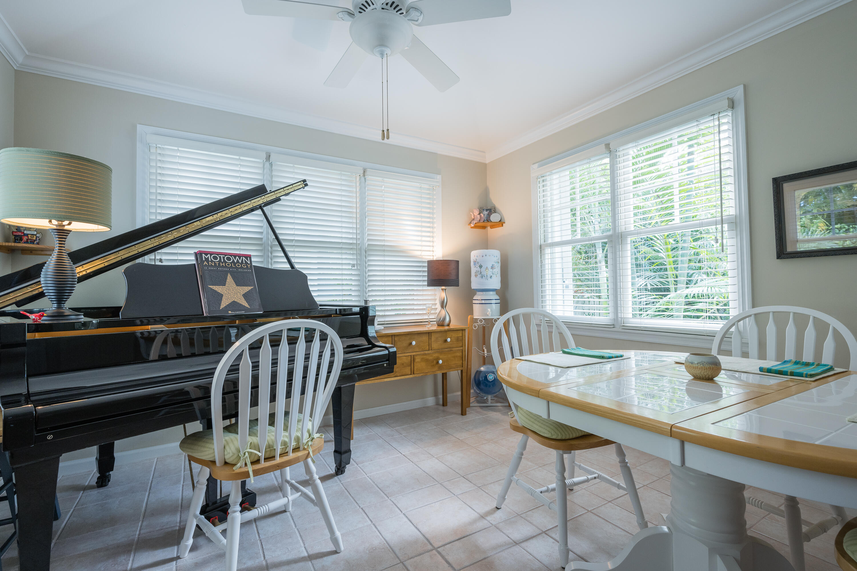28 Spoonbill Way Key West, FL 33040 - Photo 21 of 82 a dining room with furniture a chandelier and wooden floor