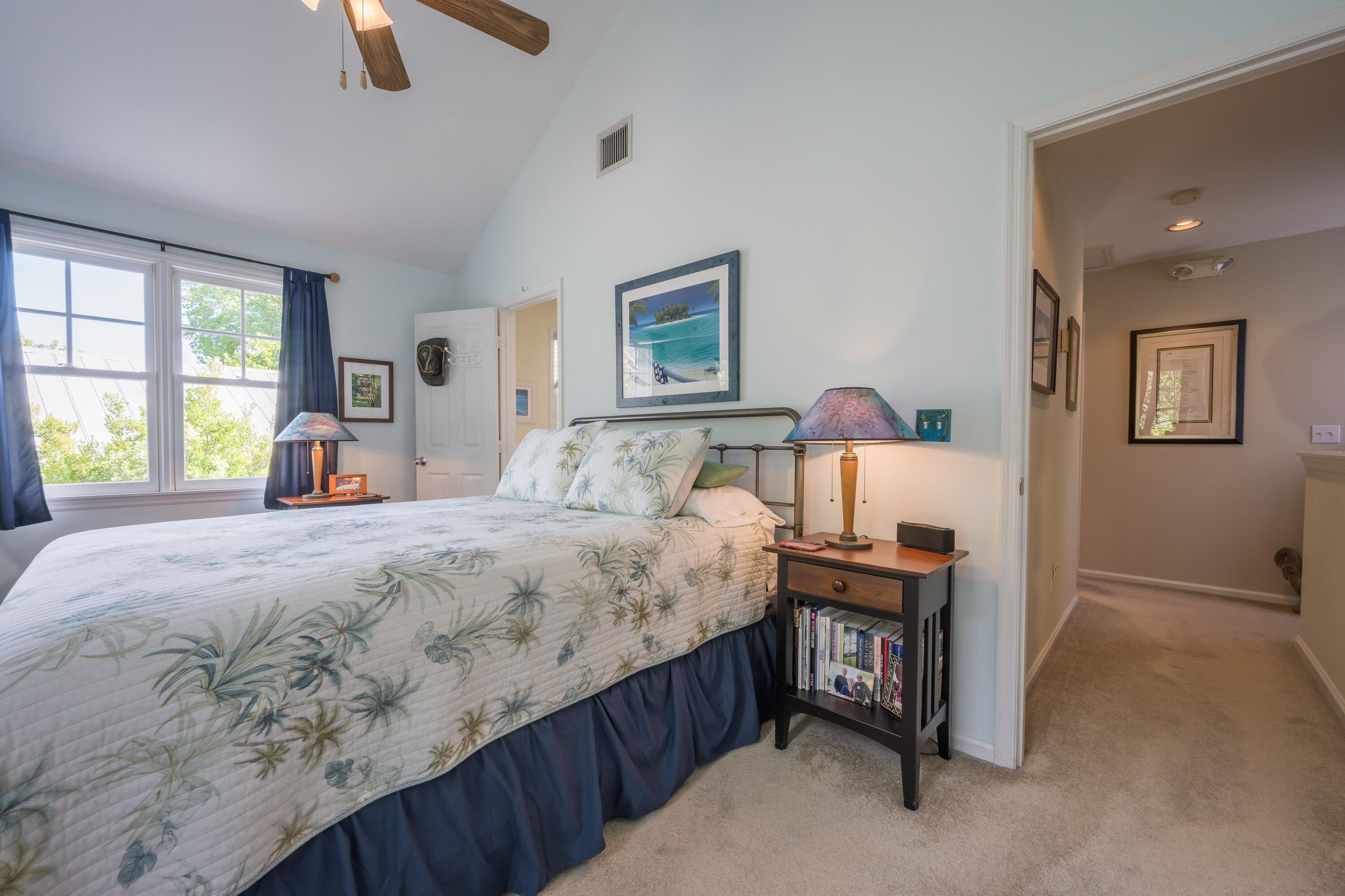 28 Spoonbill Way Key West, FL 33040 - Photo 33 of 82 a bedroom with a bed a dresser and a window