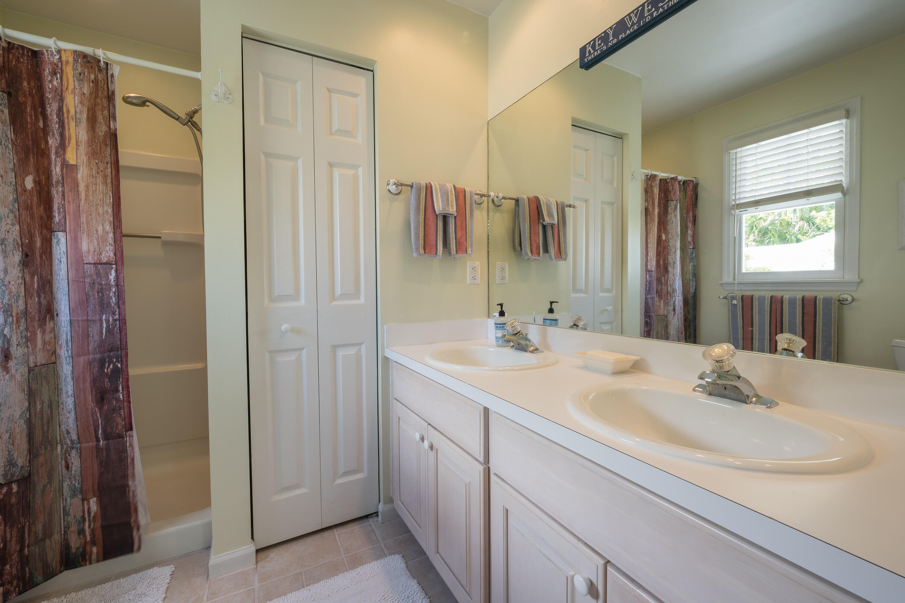 28 Spoonbill Way Key West, FL 33040 - Photo 36 of 82 a bathroom with a double vanity sink mirror and double