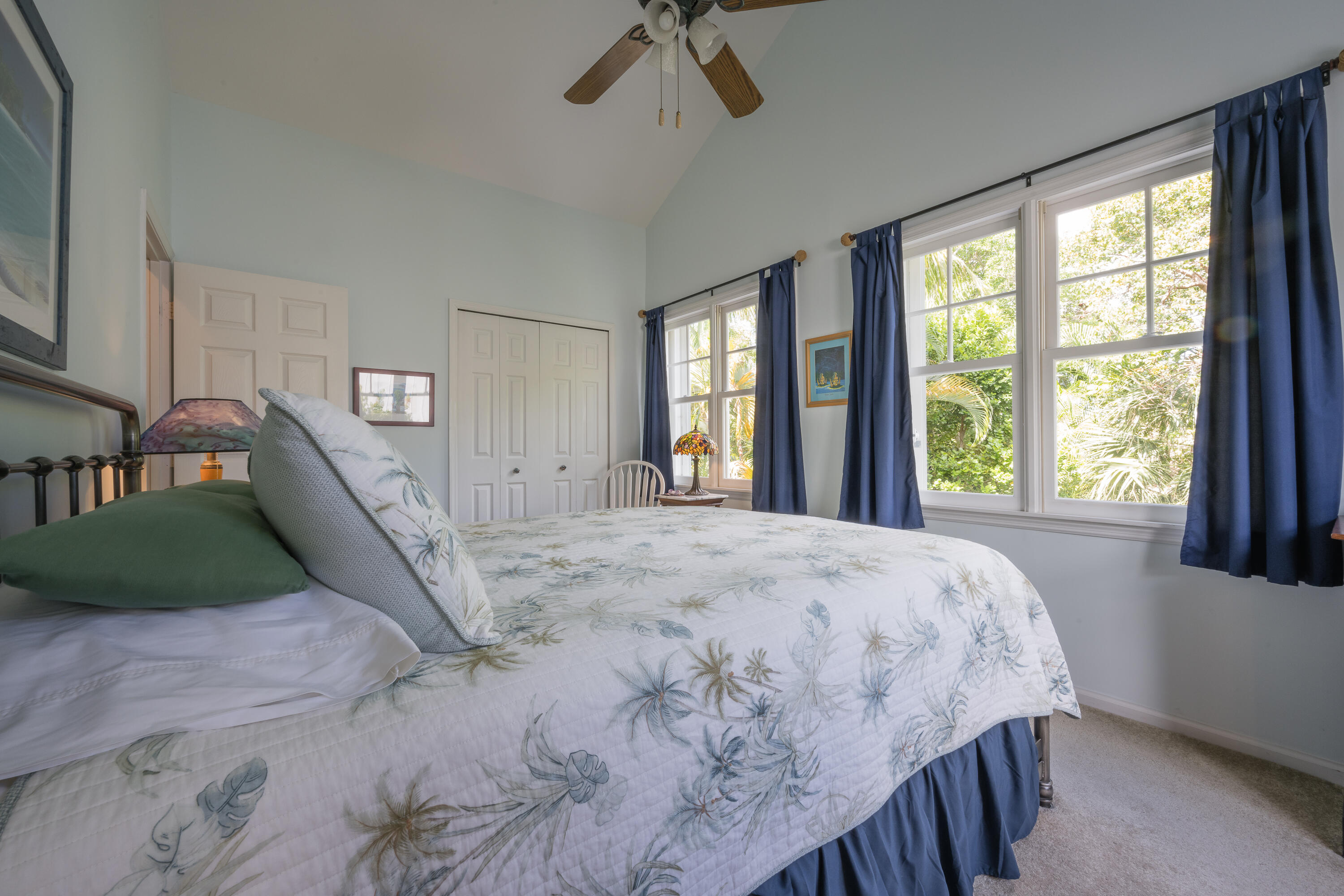 28 Spoonbill Way Key West, FL 33040 - Photo 38 of 82 a bedroom with a bed mirror and a window
