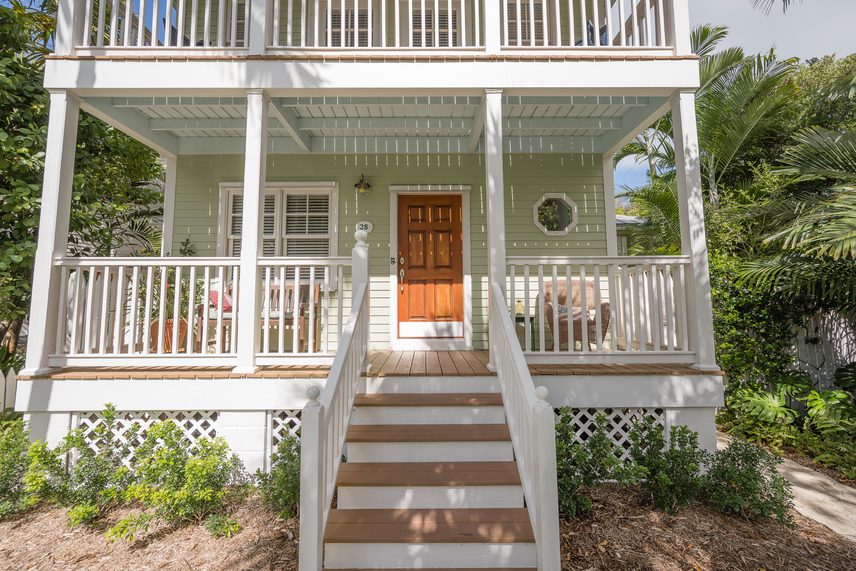 28 Spoonbill Way Key West, FL 33040 - Photo 4 of 82 a front view of a house with a garden