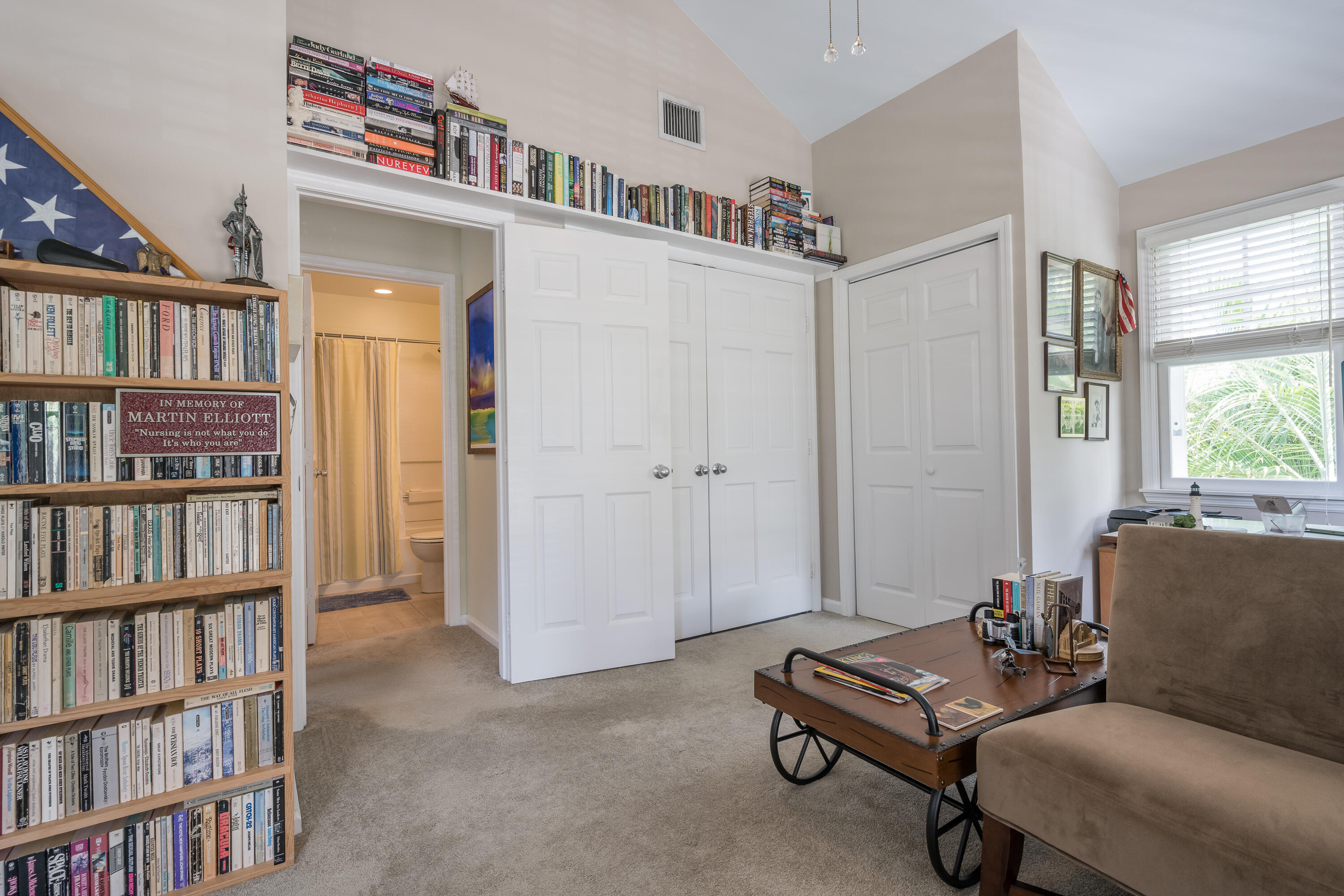 28 Spoonbill Way Key West, FL 33040 - Photo 49 of 82 a living room with furniture and a book shelf