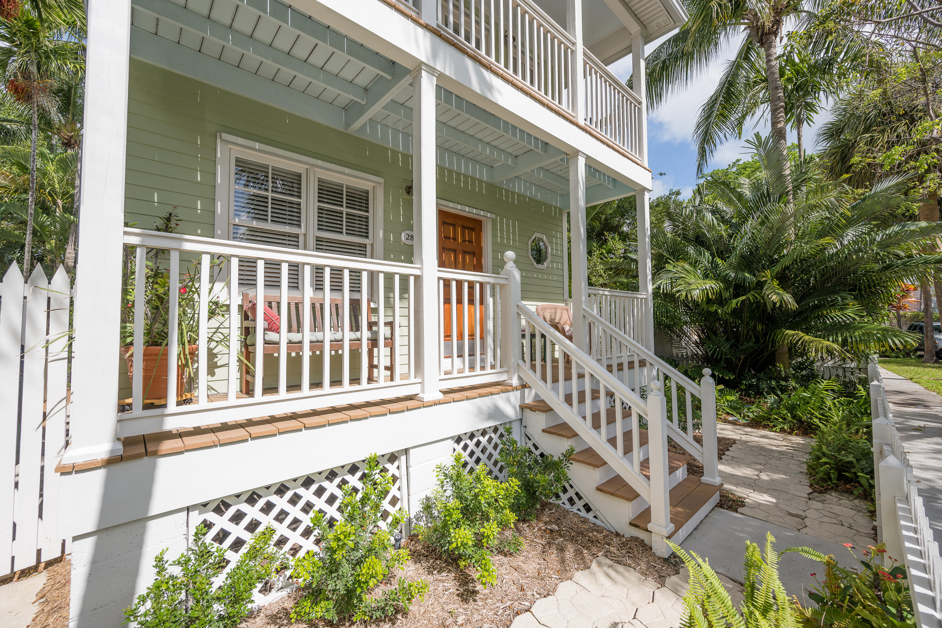28 Spoonbill Way Key West, FL 33040 - Photo 50 of 82 a view of a house with a small yard and wooden fence