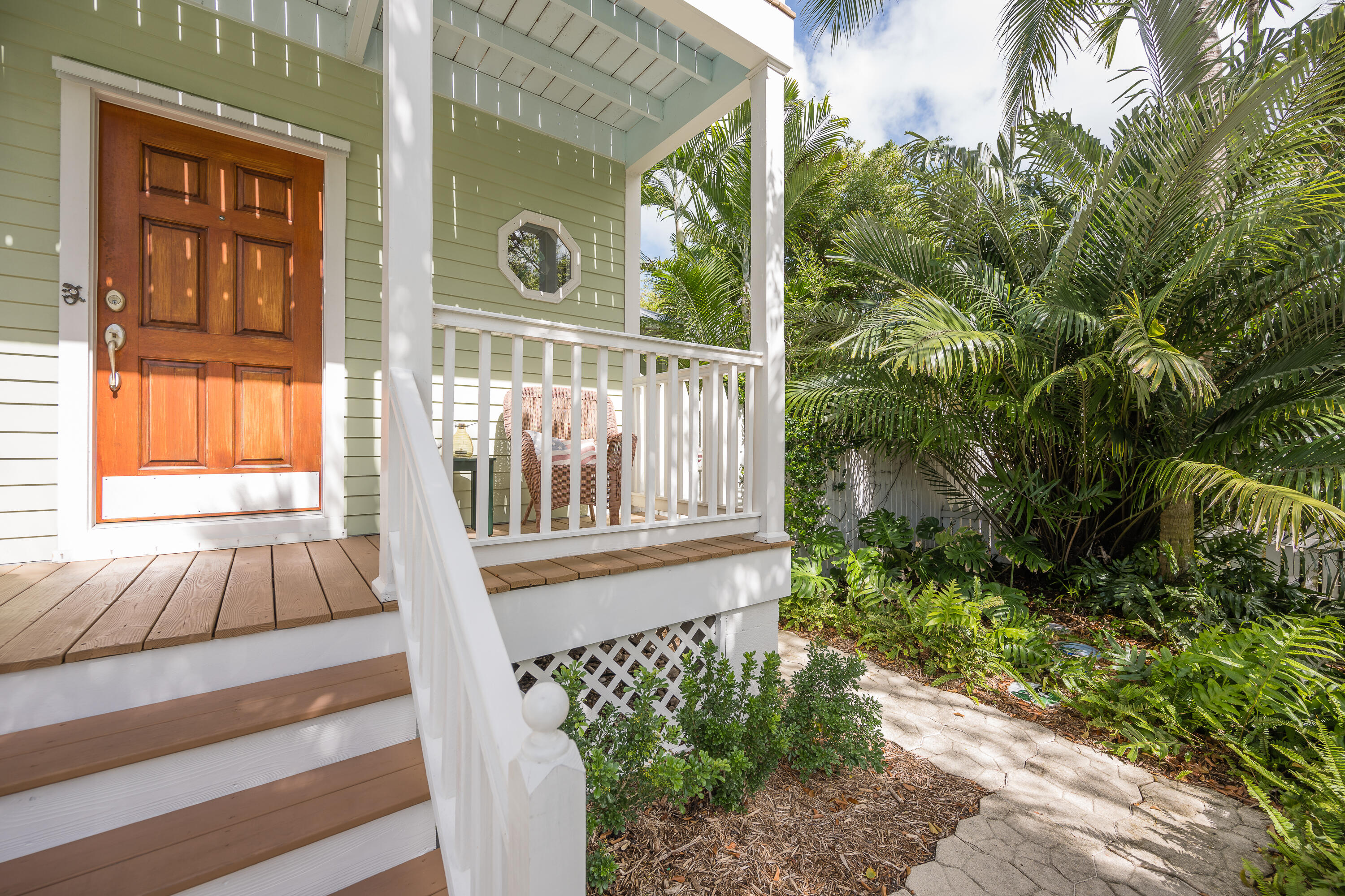 28 Spoonbill Way Key West, FL 33040 - Photo 51 of 82 a view of a house with a small yard and wooden floor and fence