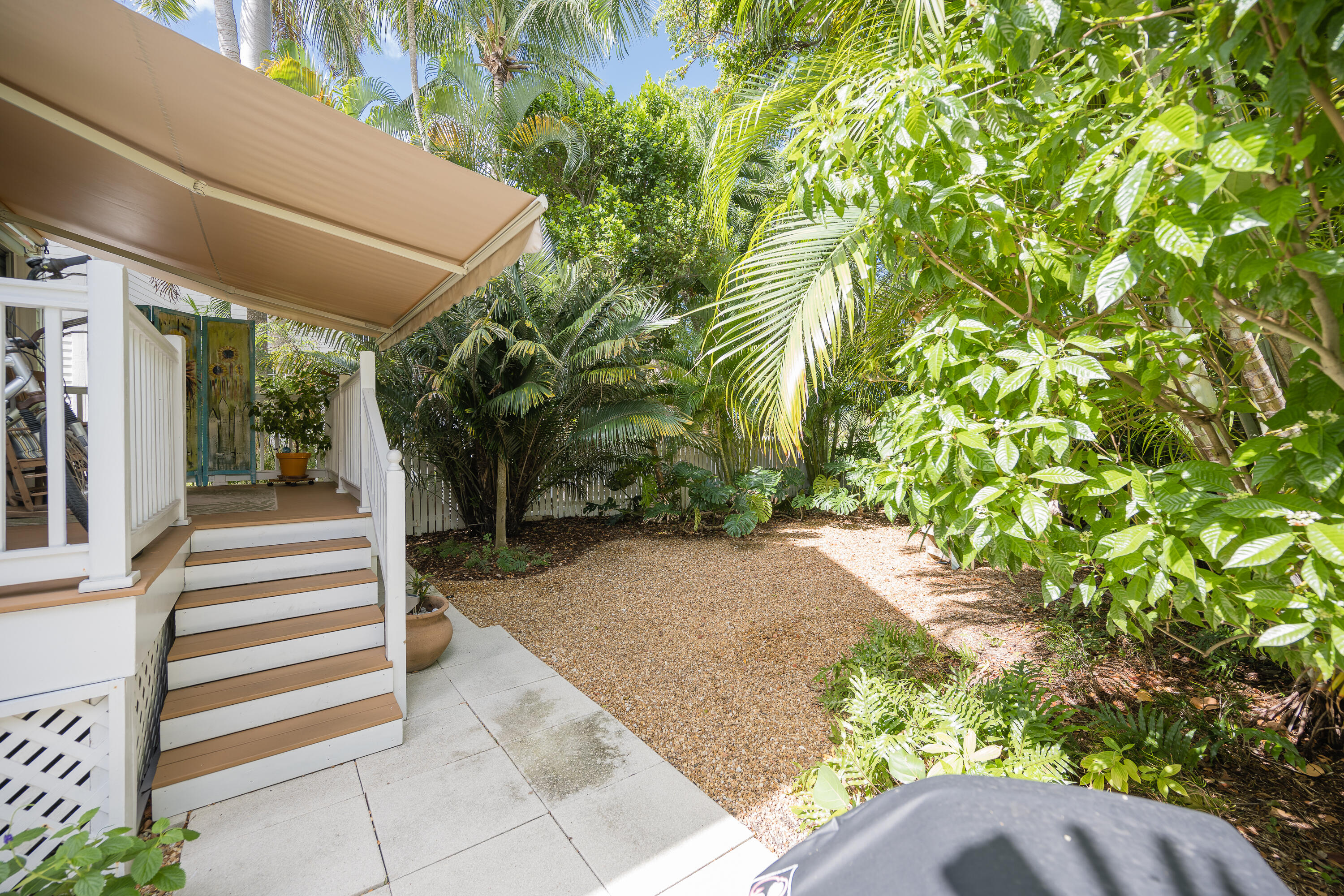 28 Spoonbill Way Key West, FL 33040 - Photo 57 of 82 a view of a pathway of a house with plants and wooden fence