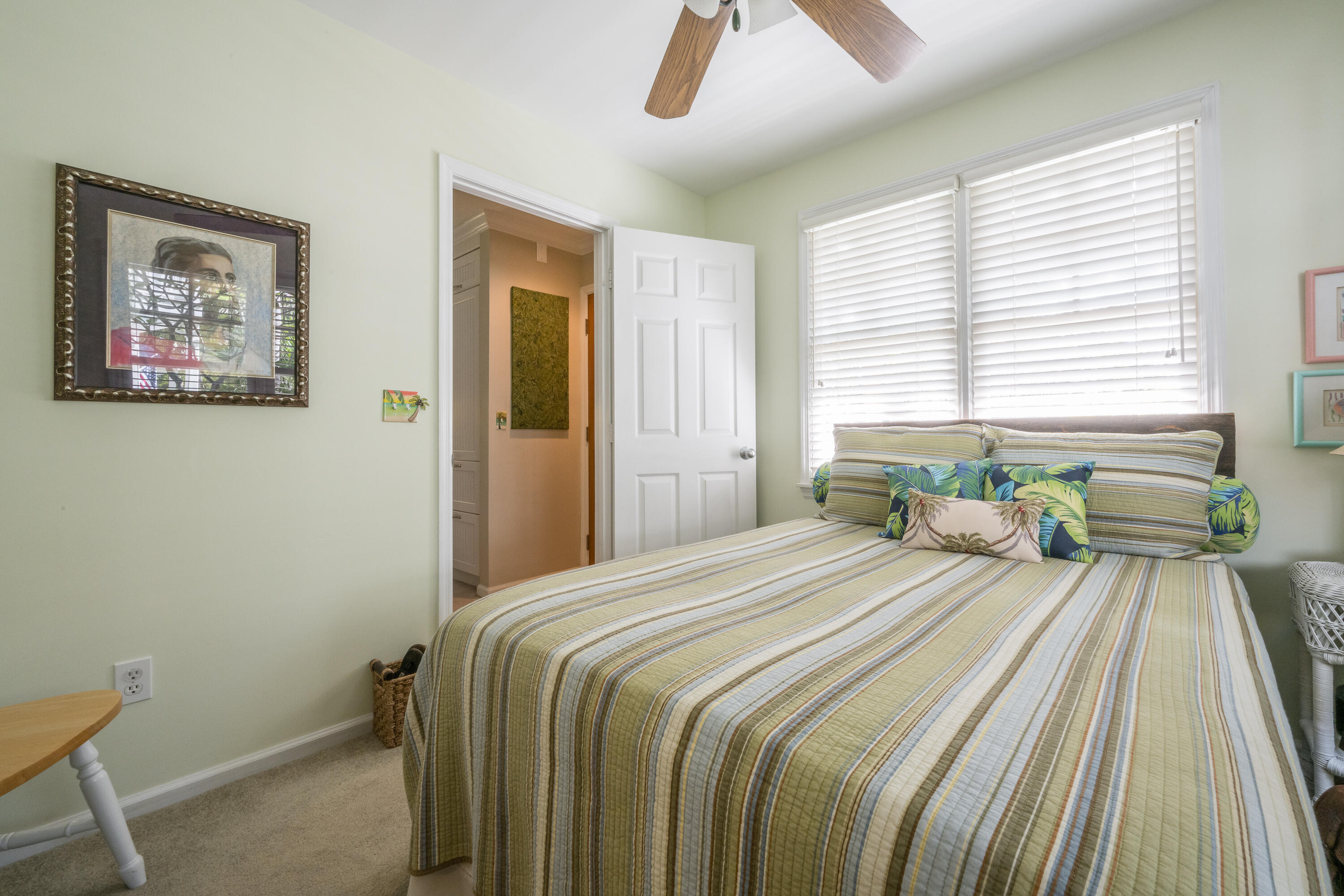 28 Spoonbill Way Key West, FL 33040 - Photo 9 of 82 a bedroom with a bed and a chandelier