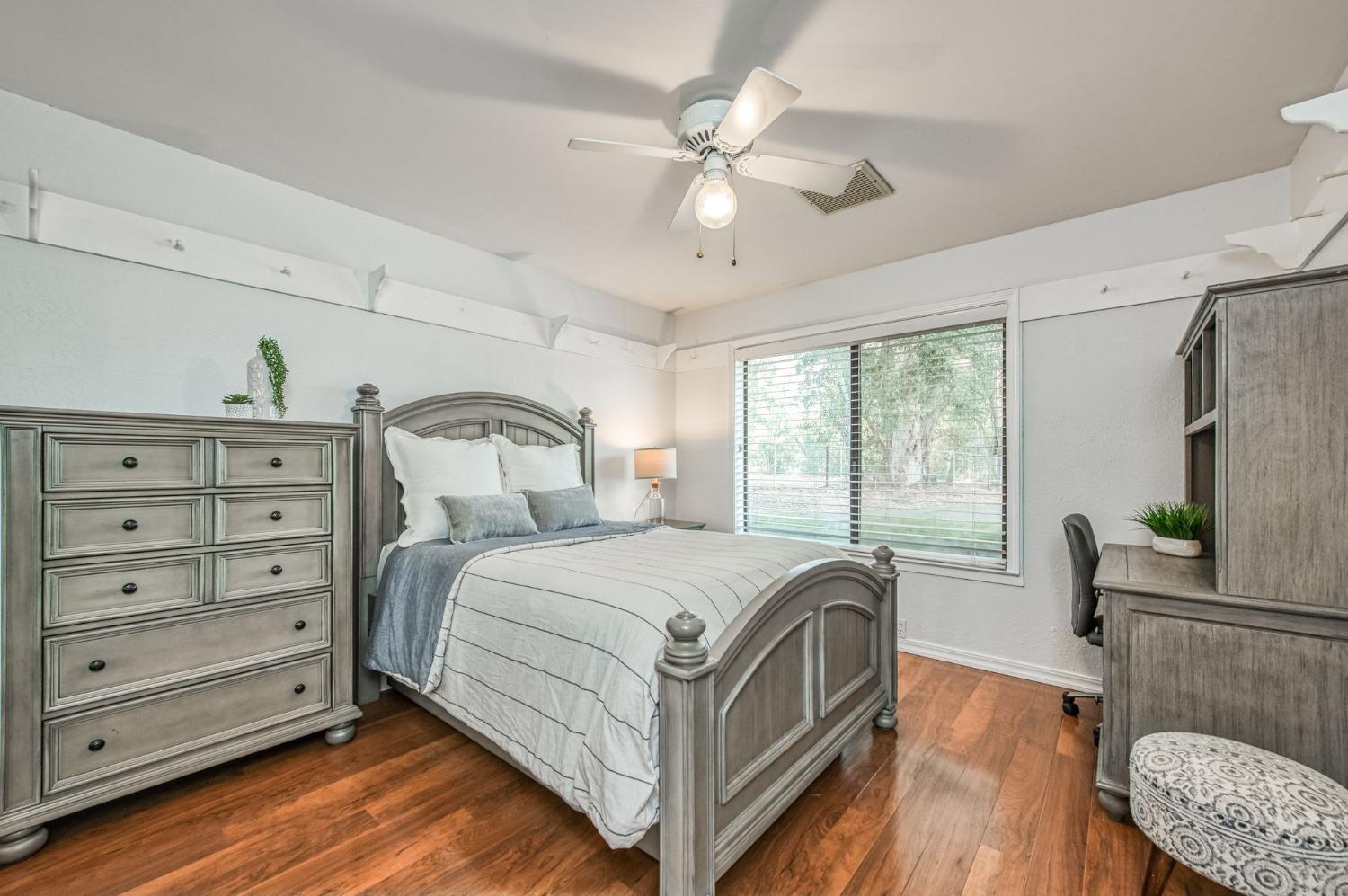 12592 Auberry Road Clovis, CA 93619 - Photo 21 of 65 a bedroom with a bed and a couch