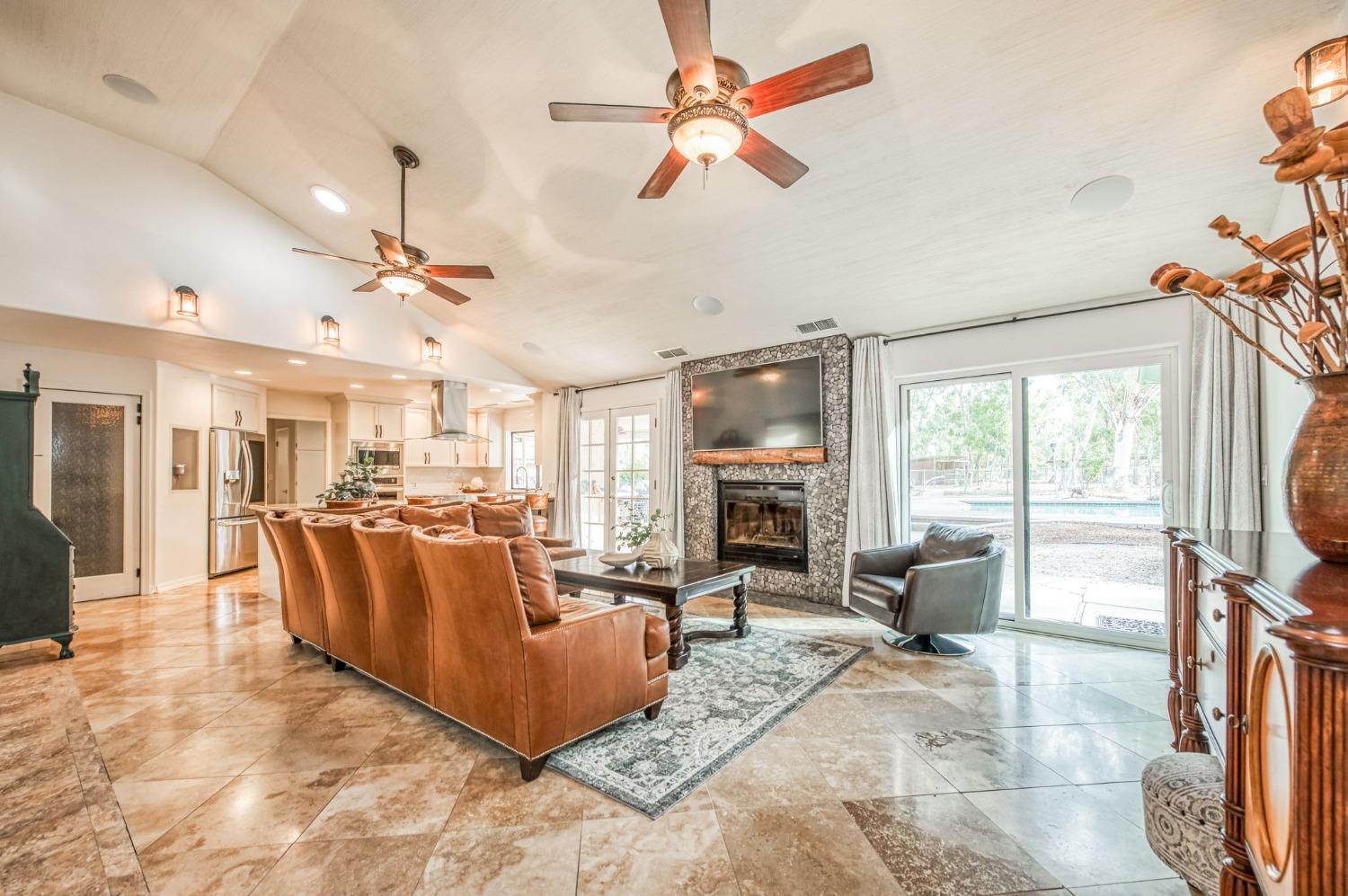 12592 Auberry Road Clovis, CA 93619 - Photo 3 of 65 a living room with fireplace furniture and a large window