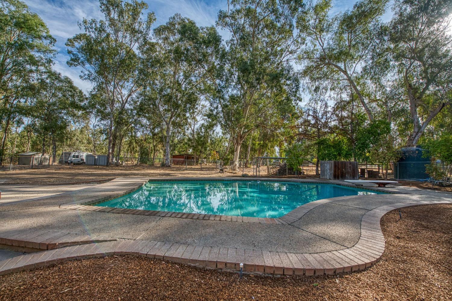 12592 Auberry Road Clovis, CA 93619 - Photo 31 of 65 front view of a house with a yard