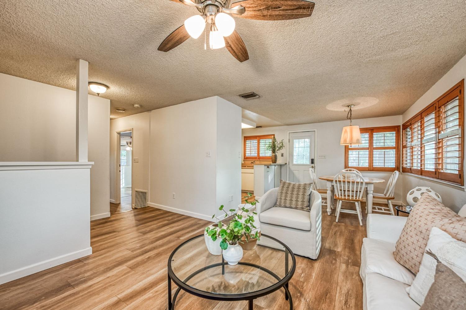 12592 Auberry Road Clovis, CA 93619 - Photo 34 of 65 a living room with furniture potted plant and a window