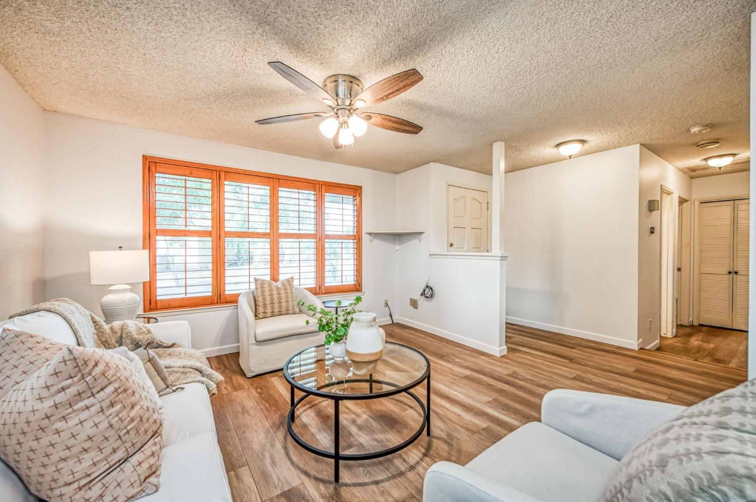 12592 Auberry Road Clovis, CA 93619 - Photo 37 of 65 a living room with furniture and a large window