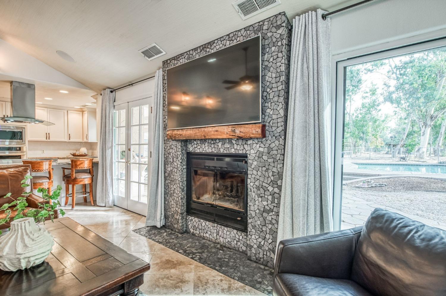 12592 Auberry Road Clovis, CA 93619 - Photo 6 of 65 a living room with furniture and a fireplace