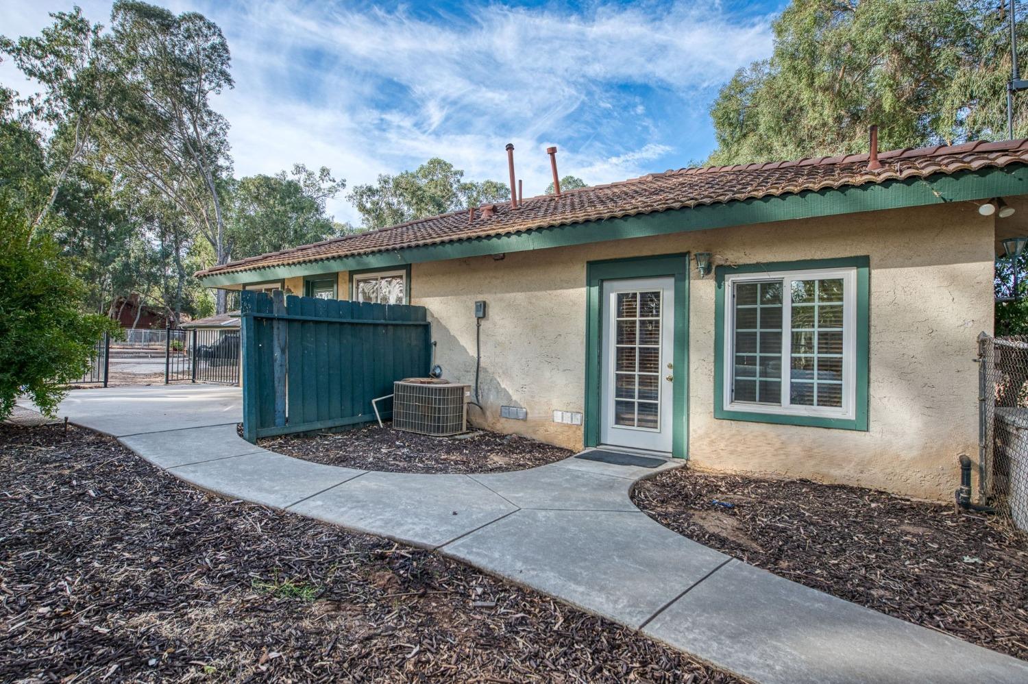 12592 Auberry Road Clovis, CA 93619 - Photo 64 of 65 a front view of a house with garden