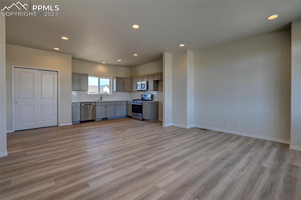 11270 Feliz Way Fountain, CO 80817 - Photo 18 of 42 a view of a kitchen with a sink and a refrigerator