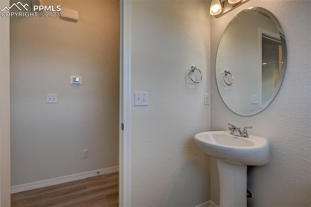 11270 Feliz Way Fountain, CO 80817 - Photo 24 of 42 a bathroom with a sink and a mirror