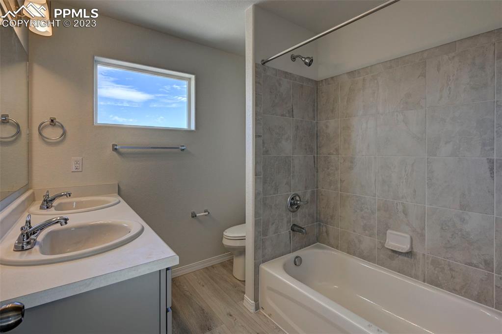 11270 Feliz Way Fountain, CO 80817 - Photo 28 of 42 a bathroom with a sink toilet and shower
