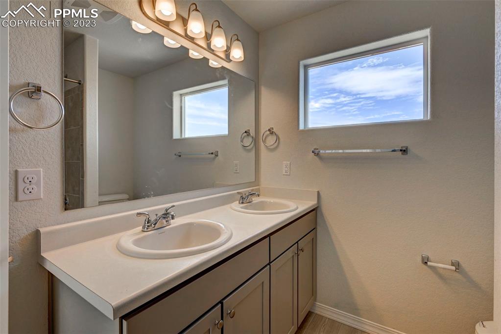 11270 Feliz Way Fountain, CO 80817 - Photo 29 of 42 a bathroom with a sink and a mirror