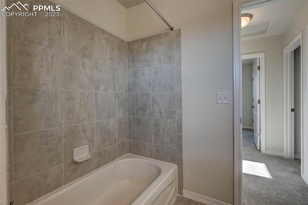 11270 Feliz Way Fountain, CO 80817 - Photo 30 of 42 a bath tub sitting next to a shower