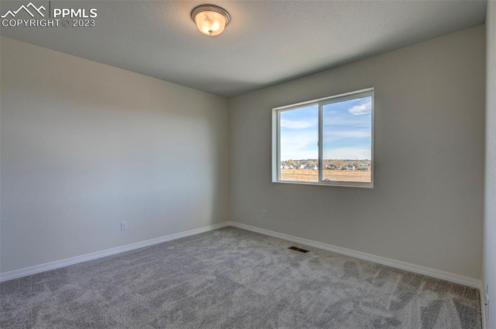 11270 Feliz Way Fountain, CO 80817 - Photo 31 of 42 a view of an empty room with a window