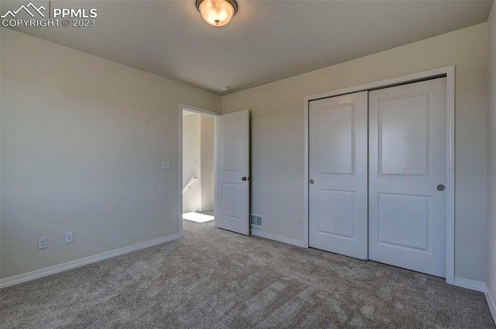 11270 Feliz Way Fountain, CO 80817 - Photo 33 of 42 an empty room with closet area