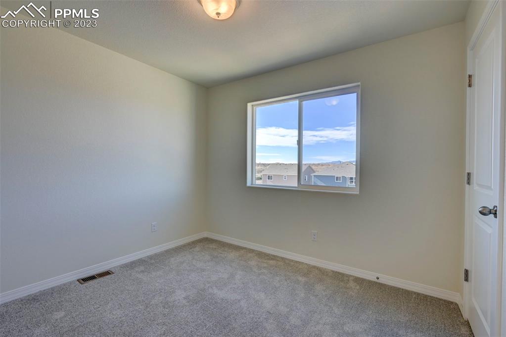 11270 Feliz Way Fountain, CO 80817 - Photo 36 of 42 an empty room with a window