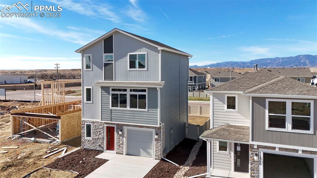 11270 Feliz Way Fountain, CO 80817 - Photo 4 of 42 a front view of a house with a yard