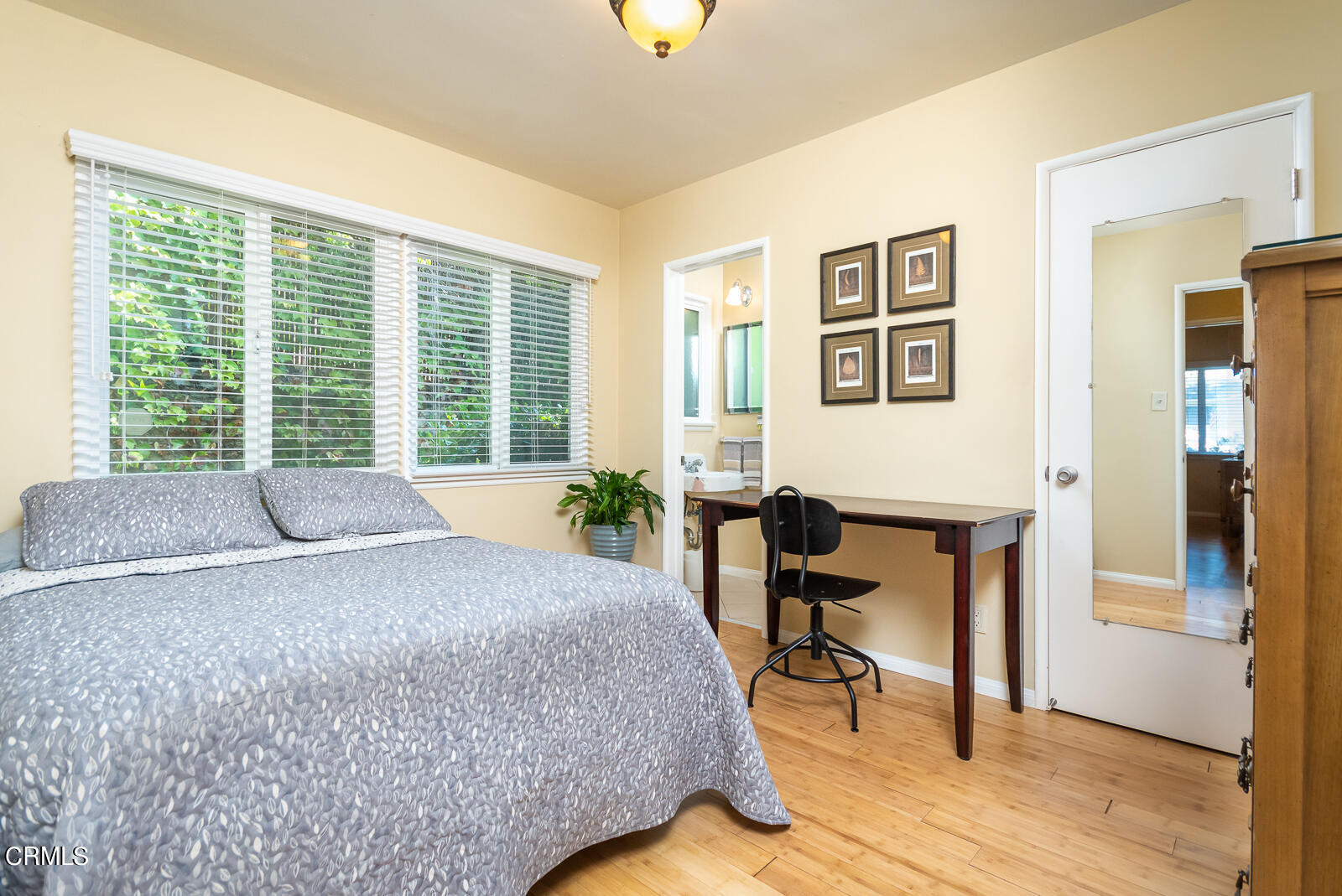 620 Jamestown Road Burbank, CA 91504 - Photo 20 of 26 a bedroom with a bed and a chair with the wooden floor