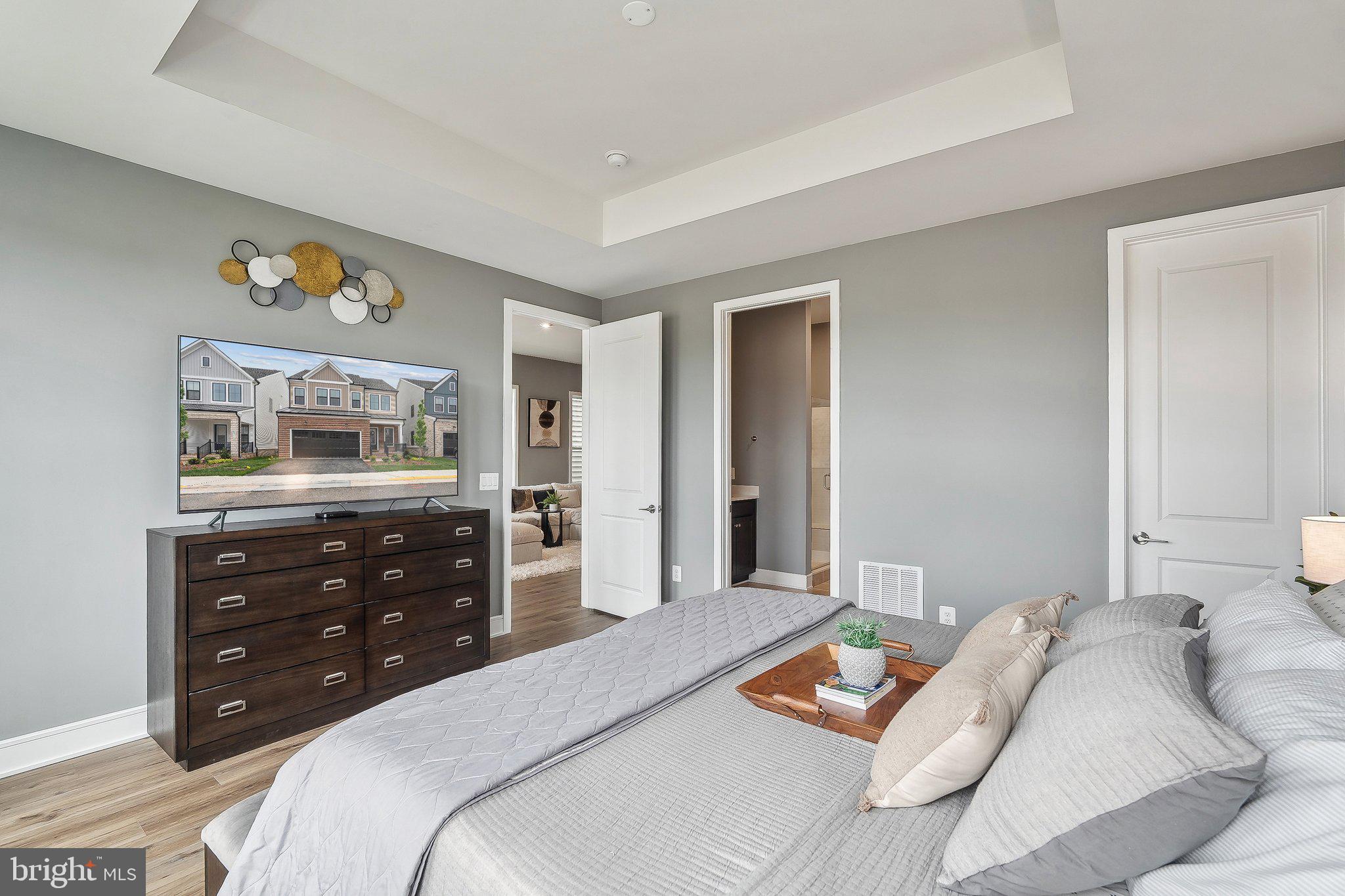43244 Greeley Square Ashburn, VA 20148 - Photo 11 of 43 a bedroom with a bed and a dresser in it