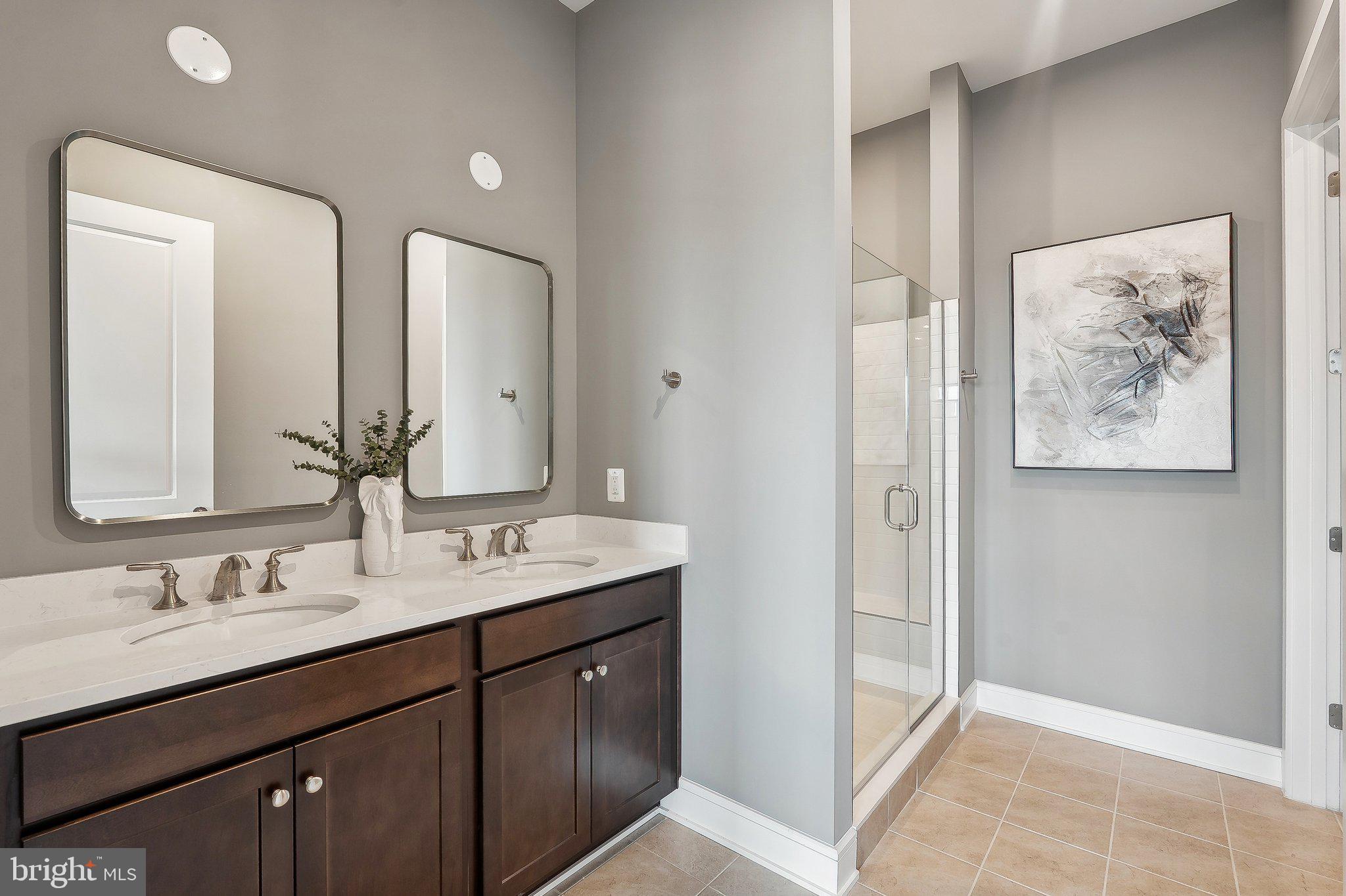 43244 Greeley Square Ashburn, VA 20148 - Photo 12 of 43 a bathroom with a double vanity sink and a mirror