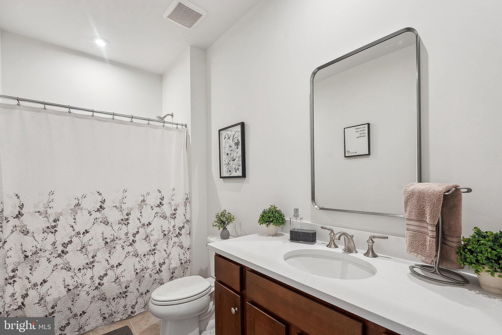 43244 Greeley Square Ashburn, VA 20148 - Photo 19 of 43 a bathroom with a sink toilet and shower