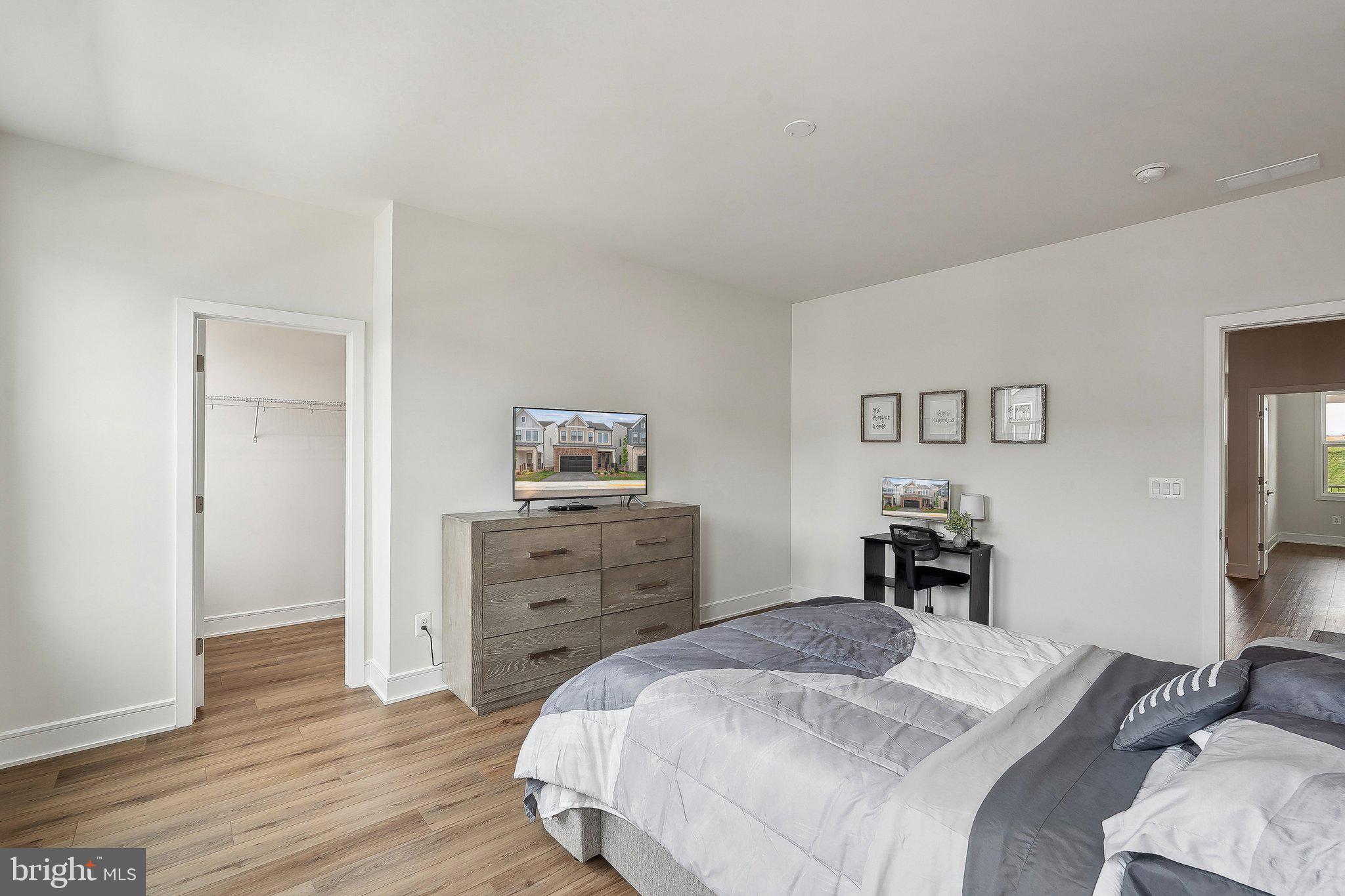 43244 Greeley Square Ashburn, VA 20148 - Photo 20 of 43 a bedroom with a bed and a dresser in it