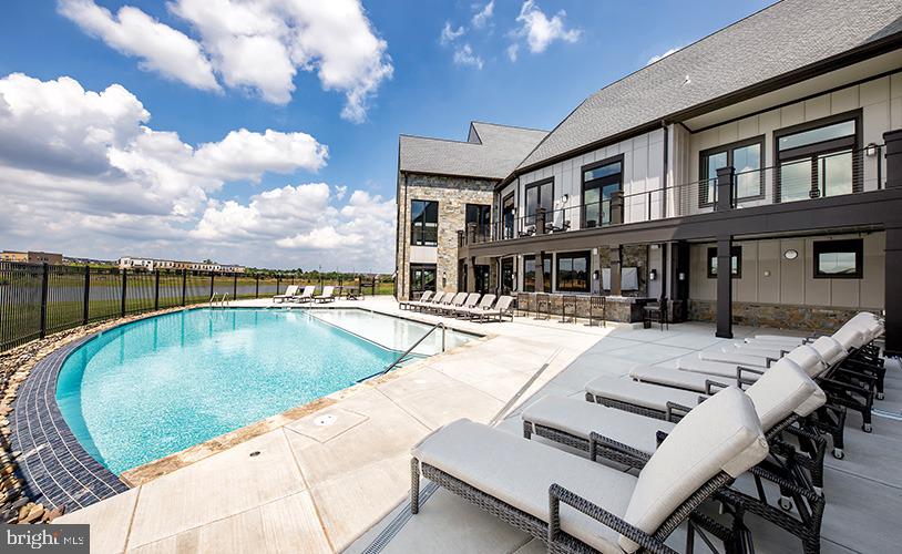 43244 Greeley Square Ashburn, VA 20148 - Photo 38 of 43 a view of a house with swimming pool and sitting area