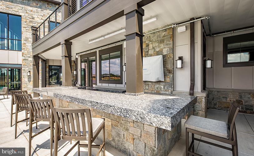 43244 Greeley Square Ashburn, VA 20148 - Photo 39 of 43 a view of a house with a porch and furniture
