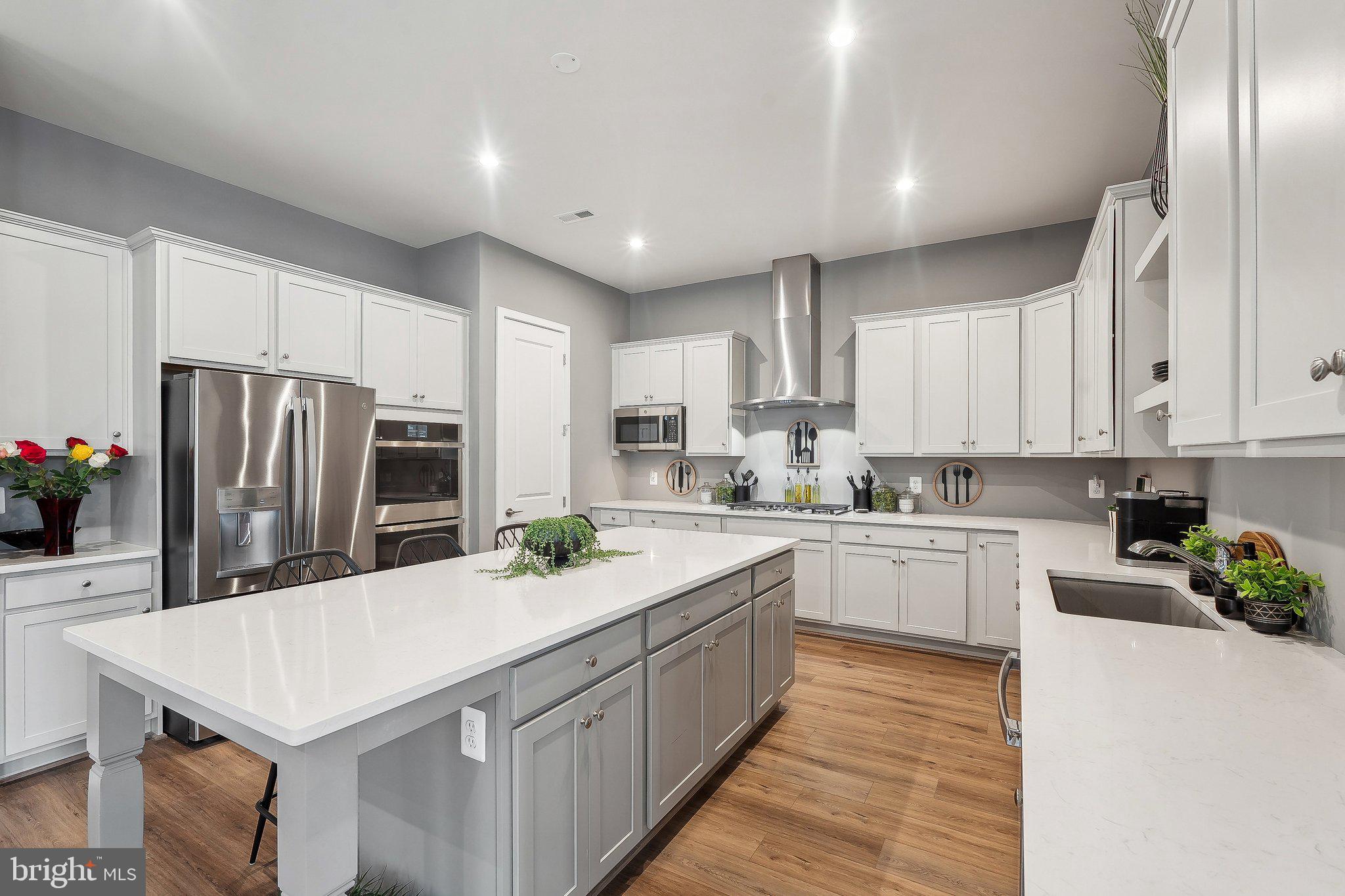 43244 Greeley Square Ashburn, VA 20148 - Photo 7 of 43 a kitchen with refrigerator and cabinets