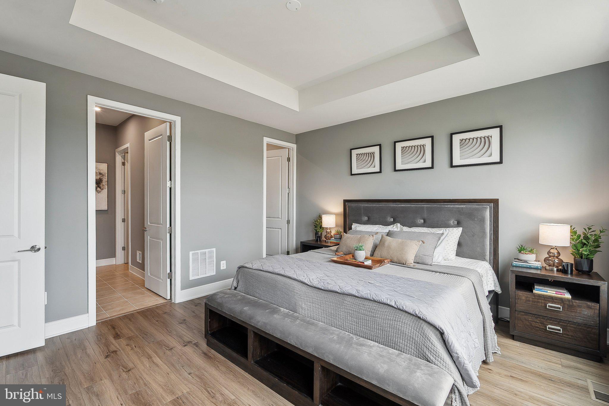 43244 Greeley Square Ashburn, VA 20148 - Photo 10 of 43 a bedroom with bed and wooden floor