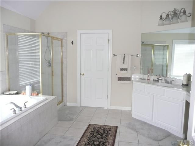 2812 Kissing Court Raleigh, NC 27613 - Photo 11 of 24 Tiled tub and separate shower, dual vanity plus space for makeup chair. Door leads to large walk-in closet. Master Bath/Spa