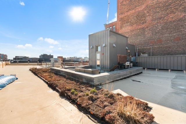 a view of a terrace with wooden floor and lake view