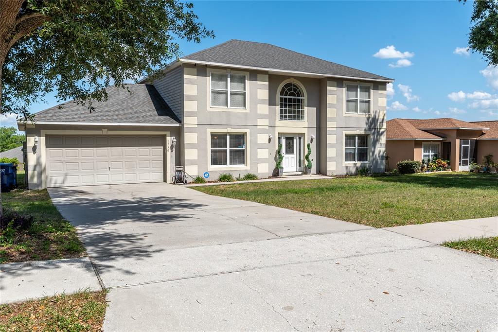 1730 Sunset Ridge Drive Mascotte, FL 34753 - Photo 1 of 1 a front view of a house with a yard