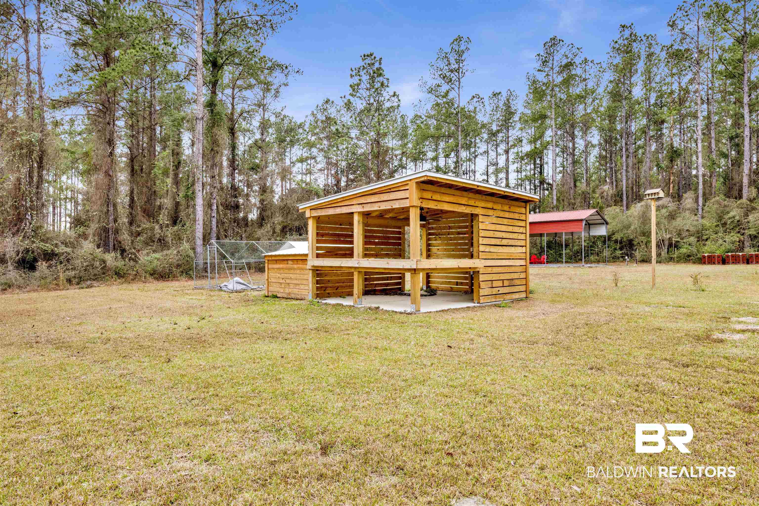 36397 Alexandria Trail Stapleton, AL 36578 - Photo 58 of 65 View of green lawn with an outbuilding and view of scattered trees